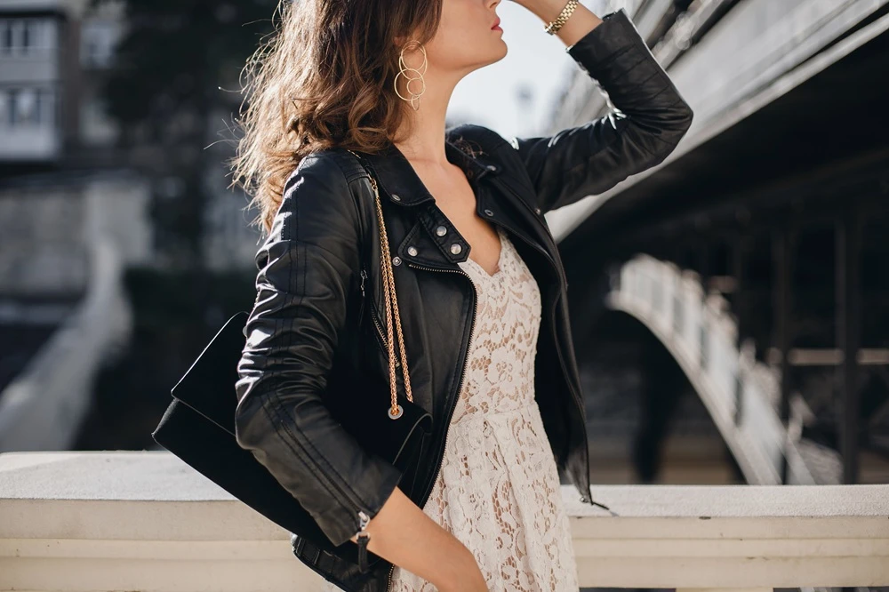 attractive woman walking in street in fashionable outfit
